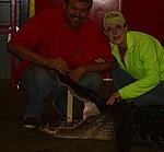 Me and my husband with a 13 foot gator that came into our processing plant